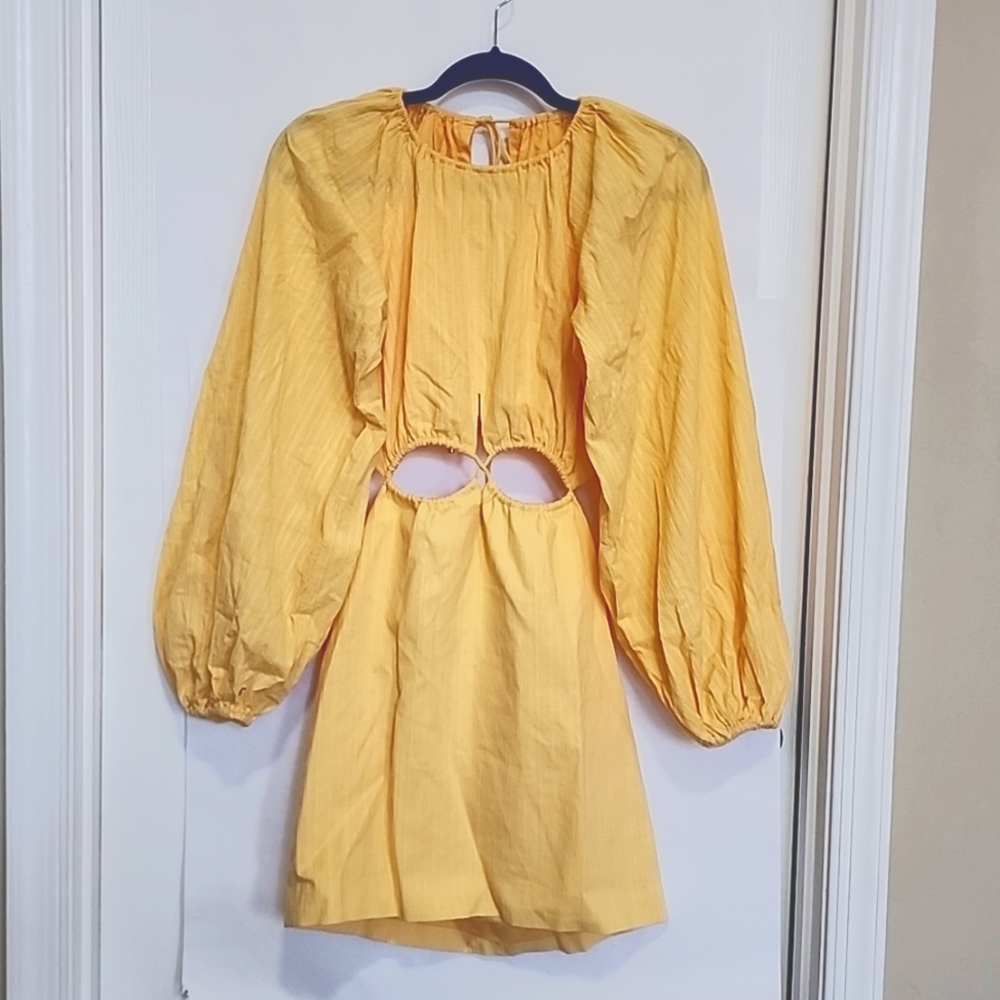 Sunflower yellow mini dress fully lined with cutouts, long sleeves.